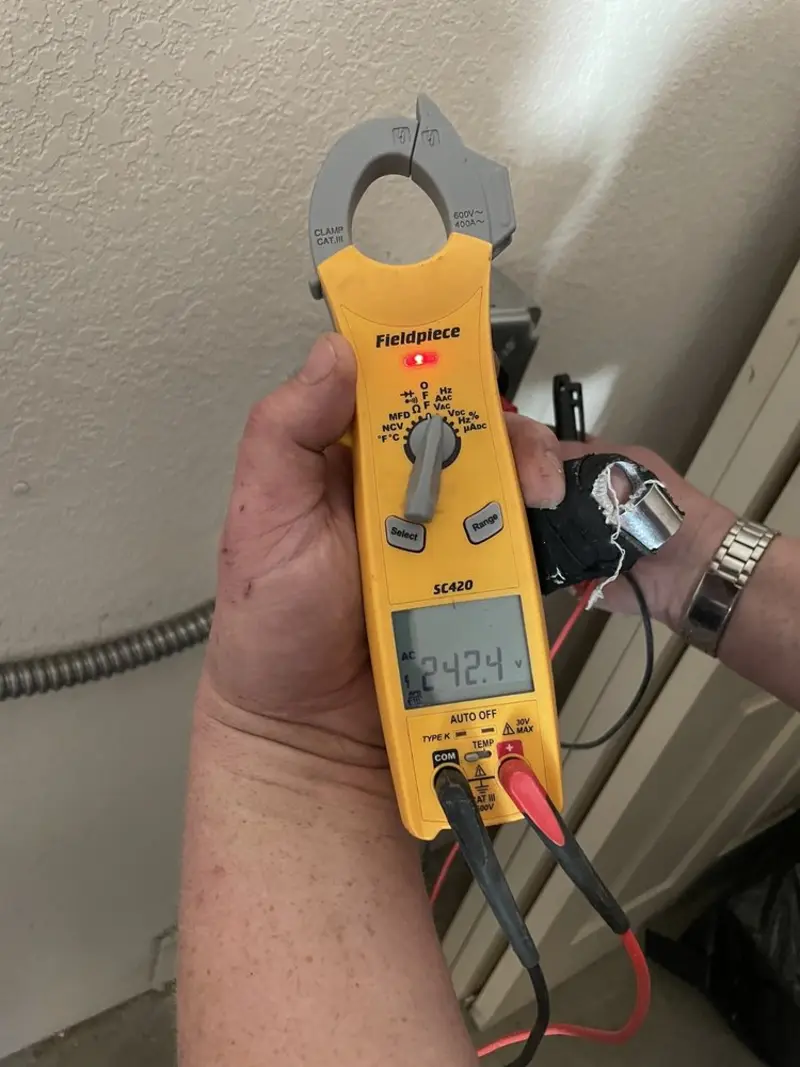 Voltage testing with clamp meter during Ceiling Fan Installation in Brattleboro